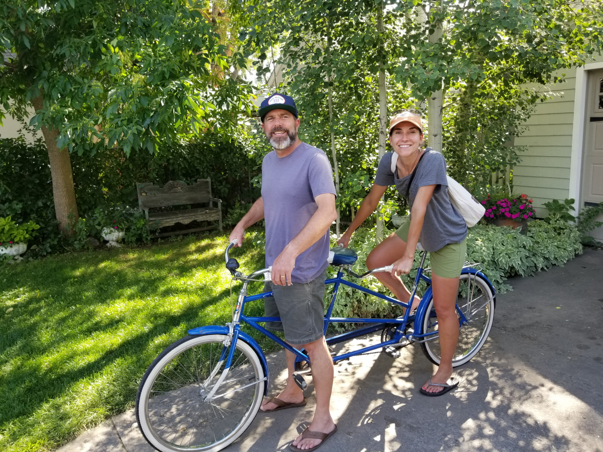 Kenneth and Judy riding a vintage tandem bicycle